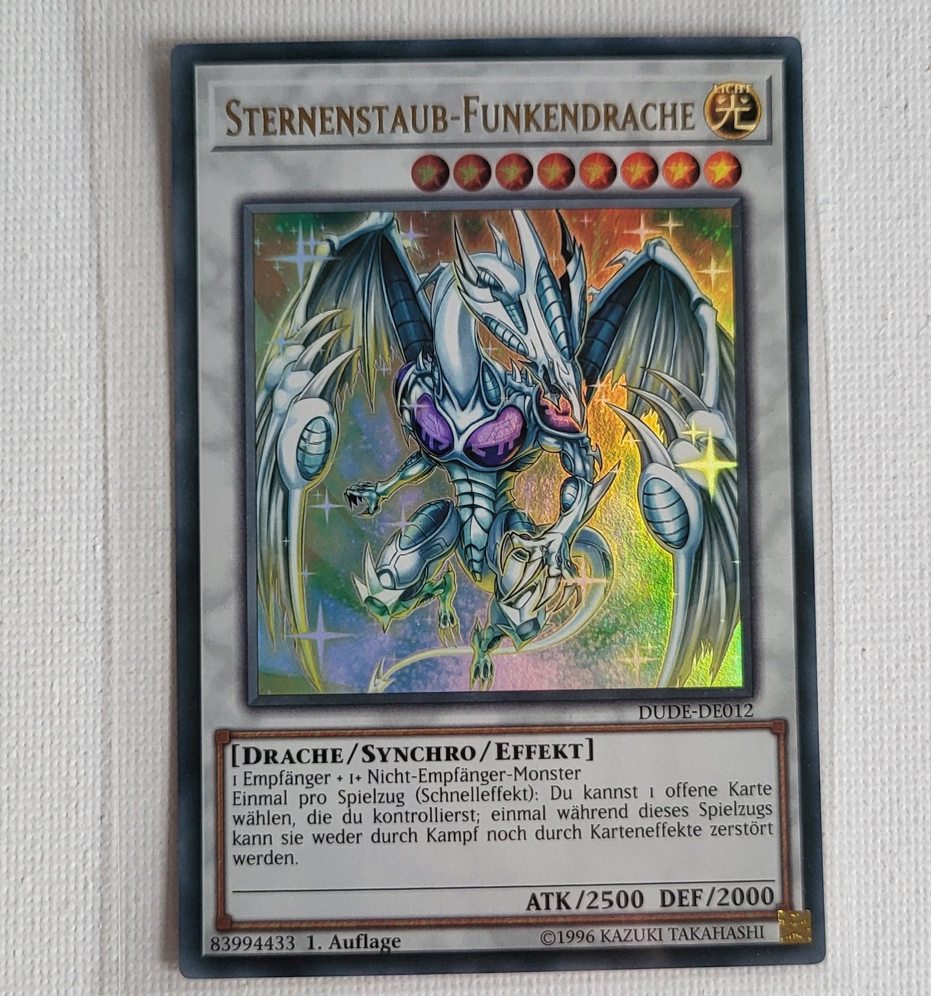 Yu-Gi-Oh! Sternenstaub-Funkendrache (DUDE-DE012) – Light Played